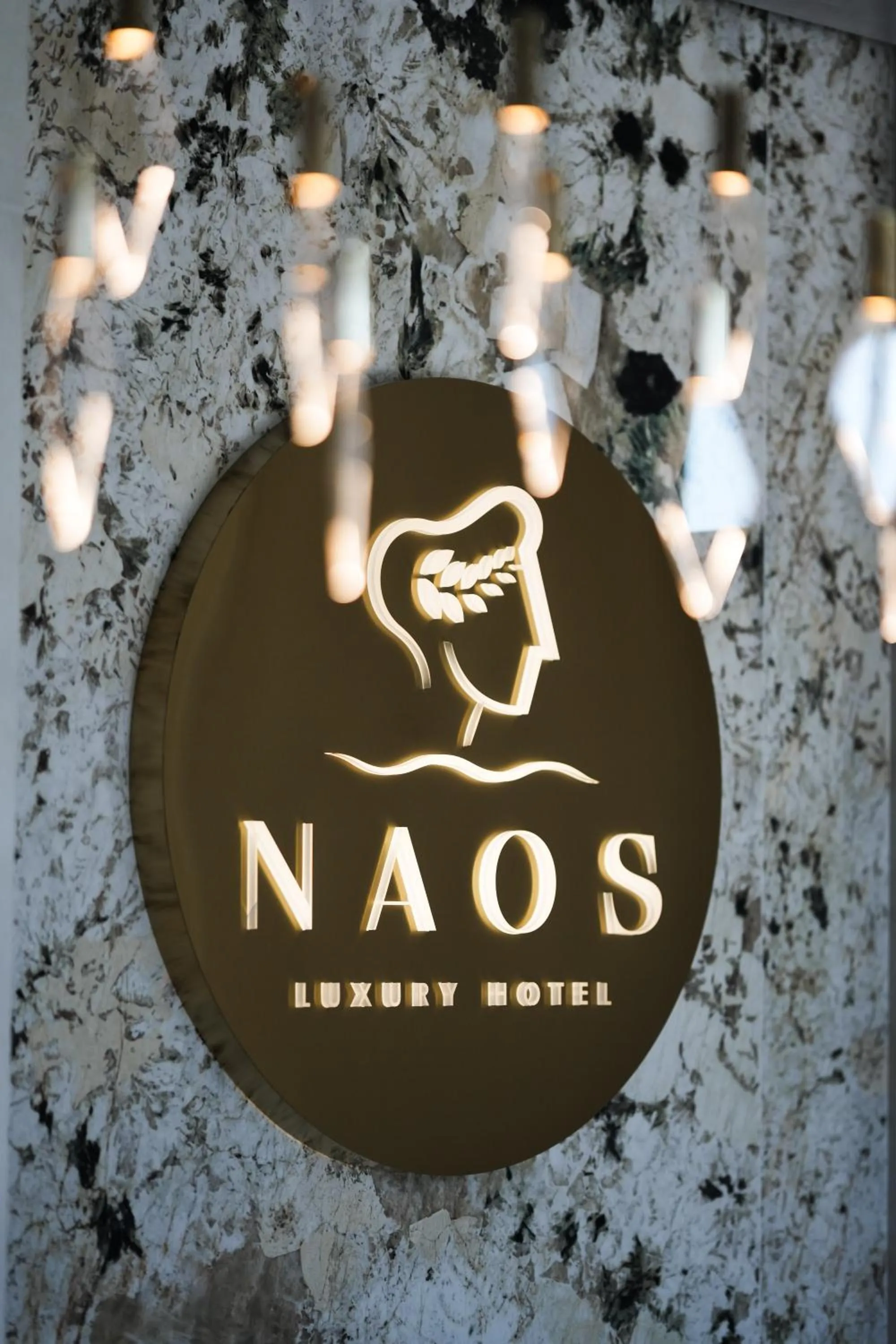 Property logo or sign in Naos Luxury Hotel