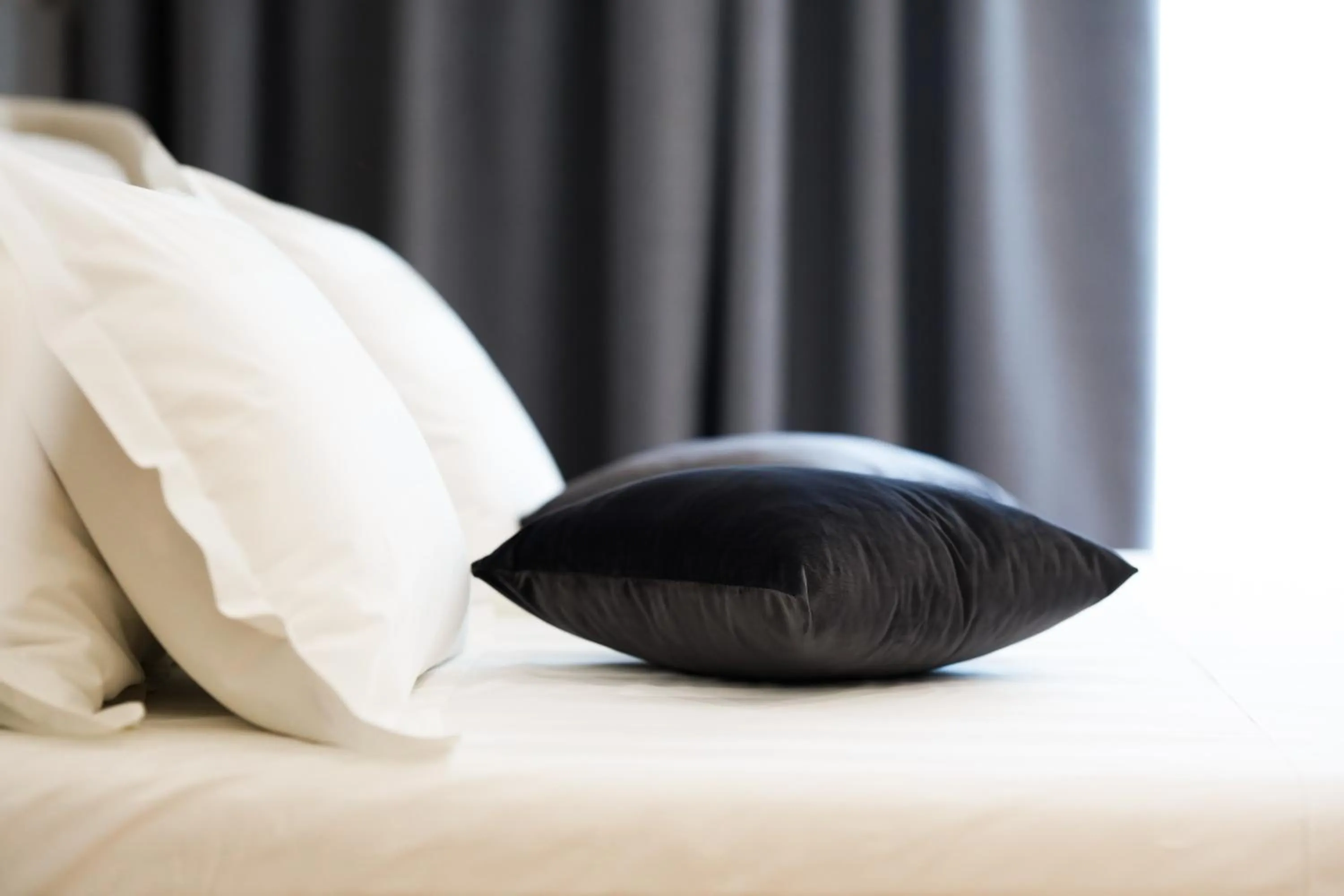 Bed in Naos Luxury Hotel