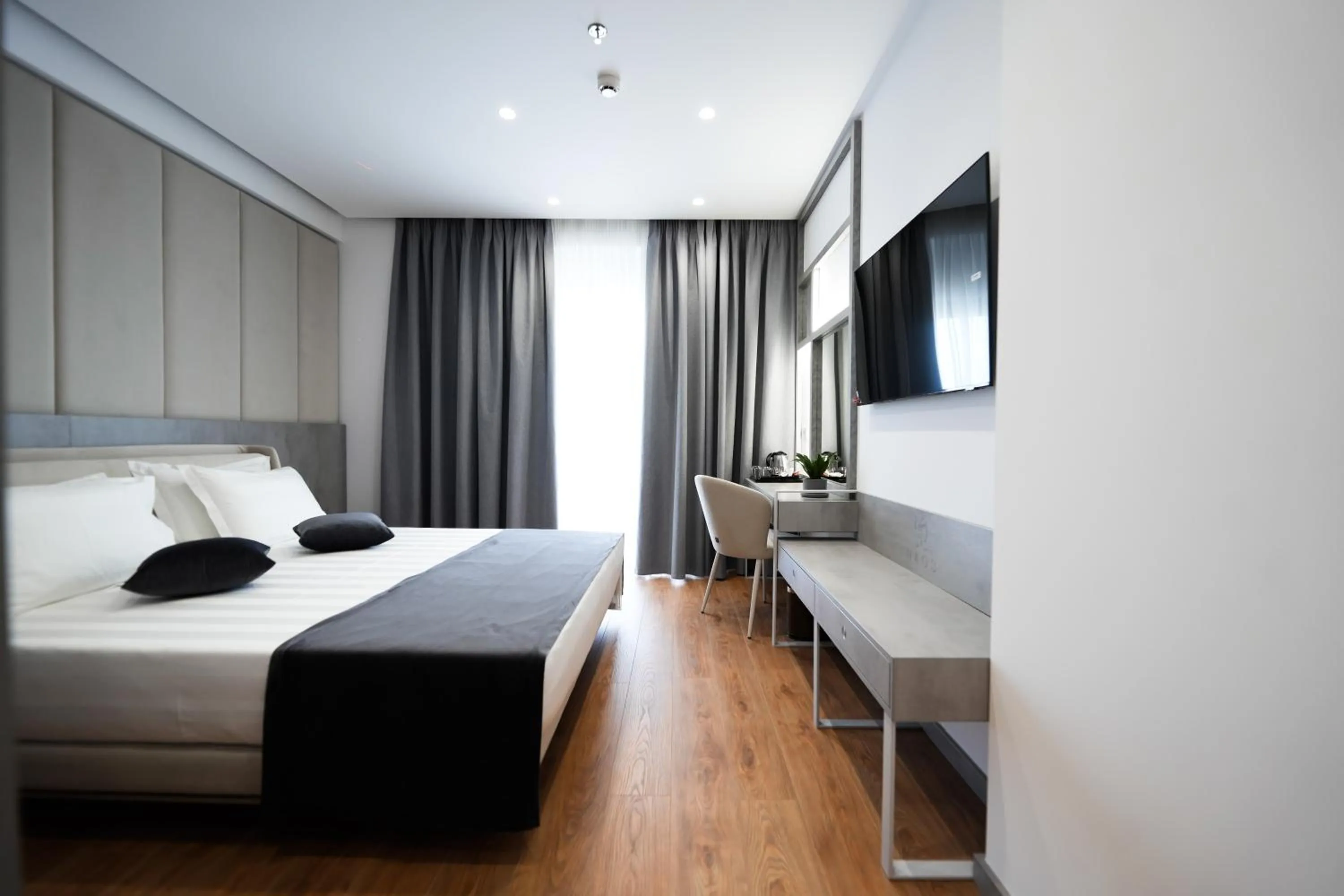 Photo of the whole room, Bed in Naos Luxury Hotel