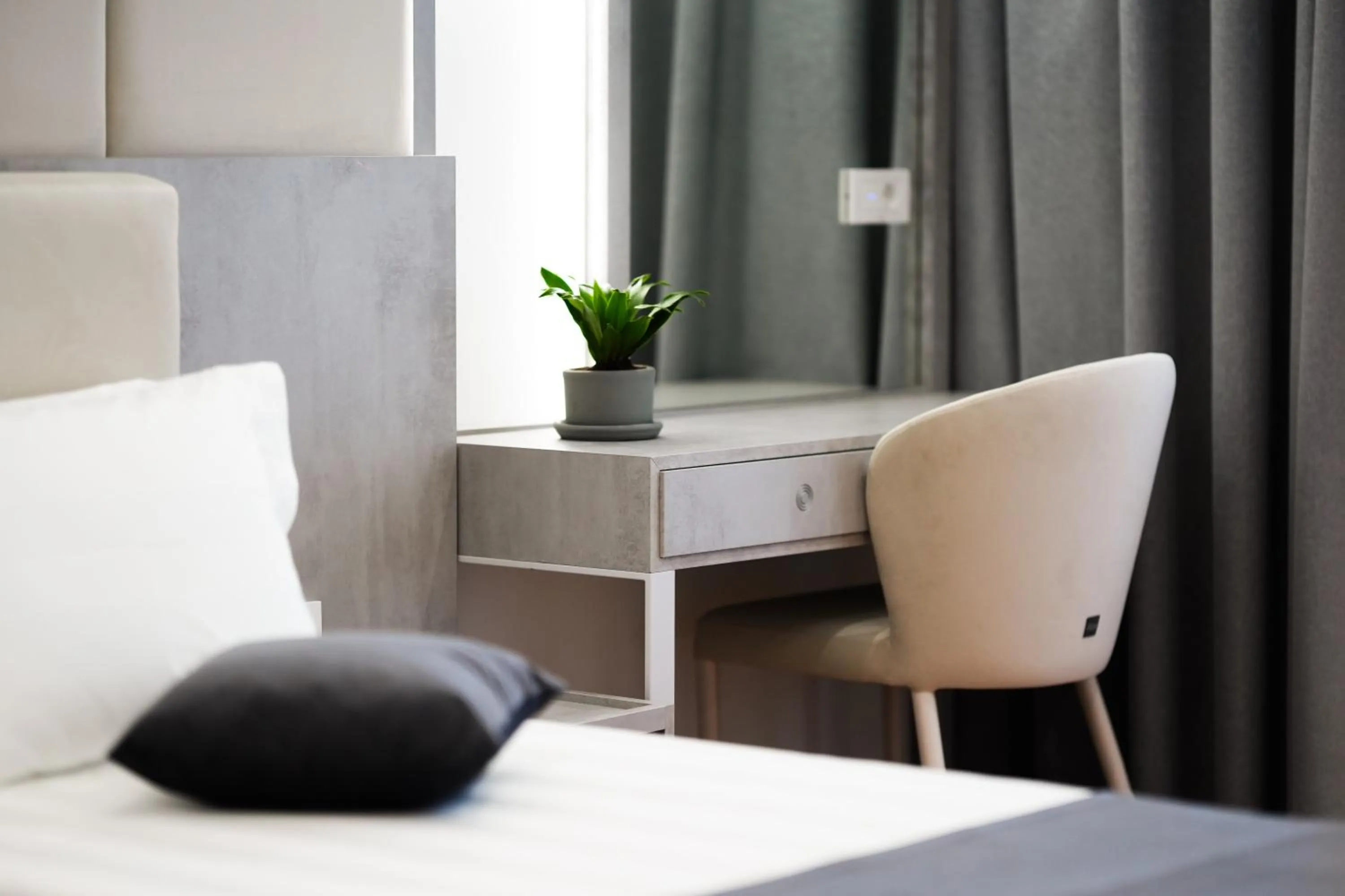 Bed in Naos Luxury Hotel