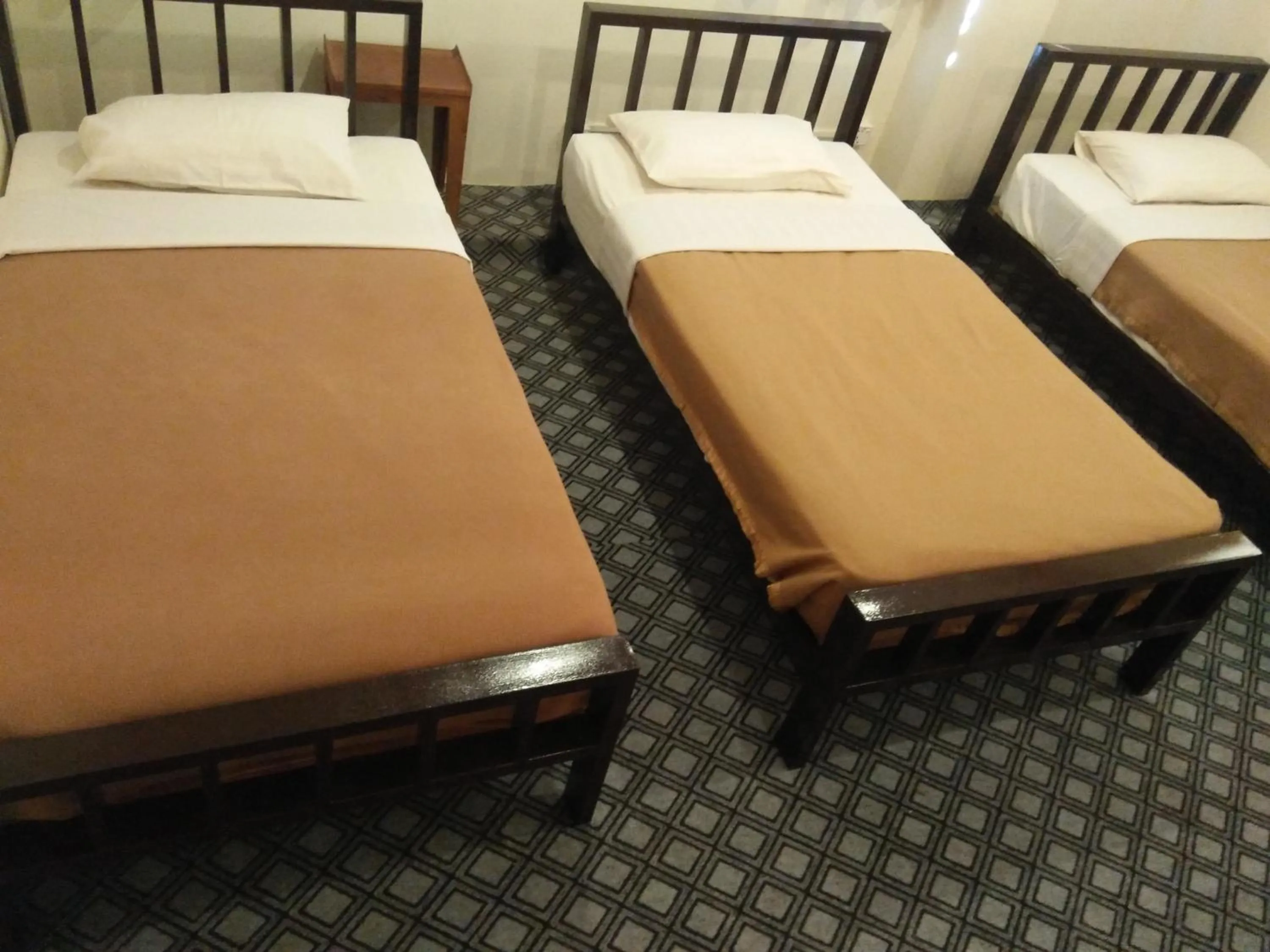 Bed in Northern Breeze Hotel