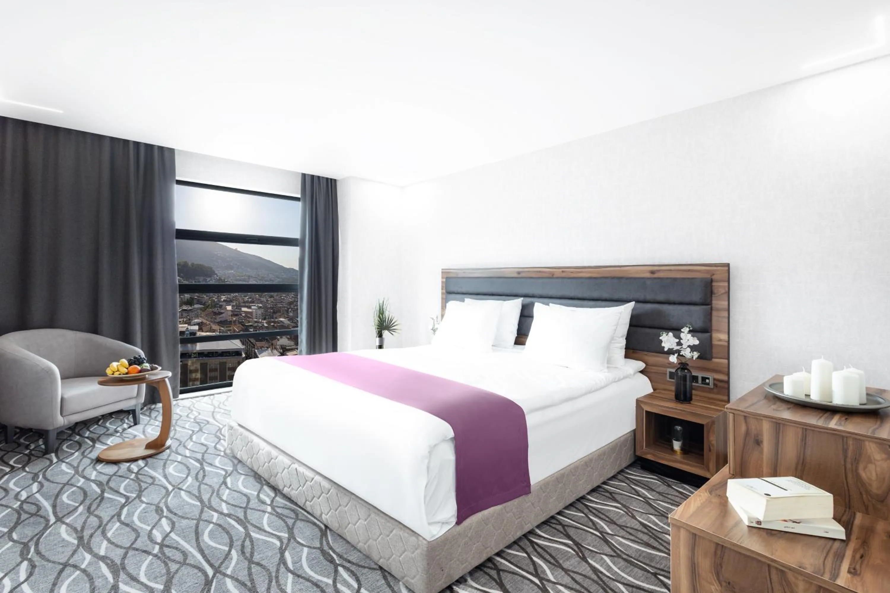 Bed in Lilium Hotel & Suites