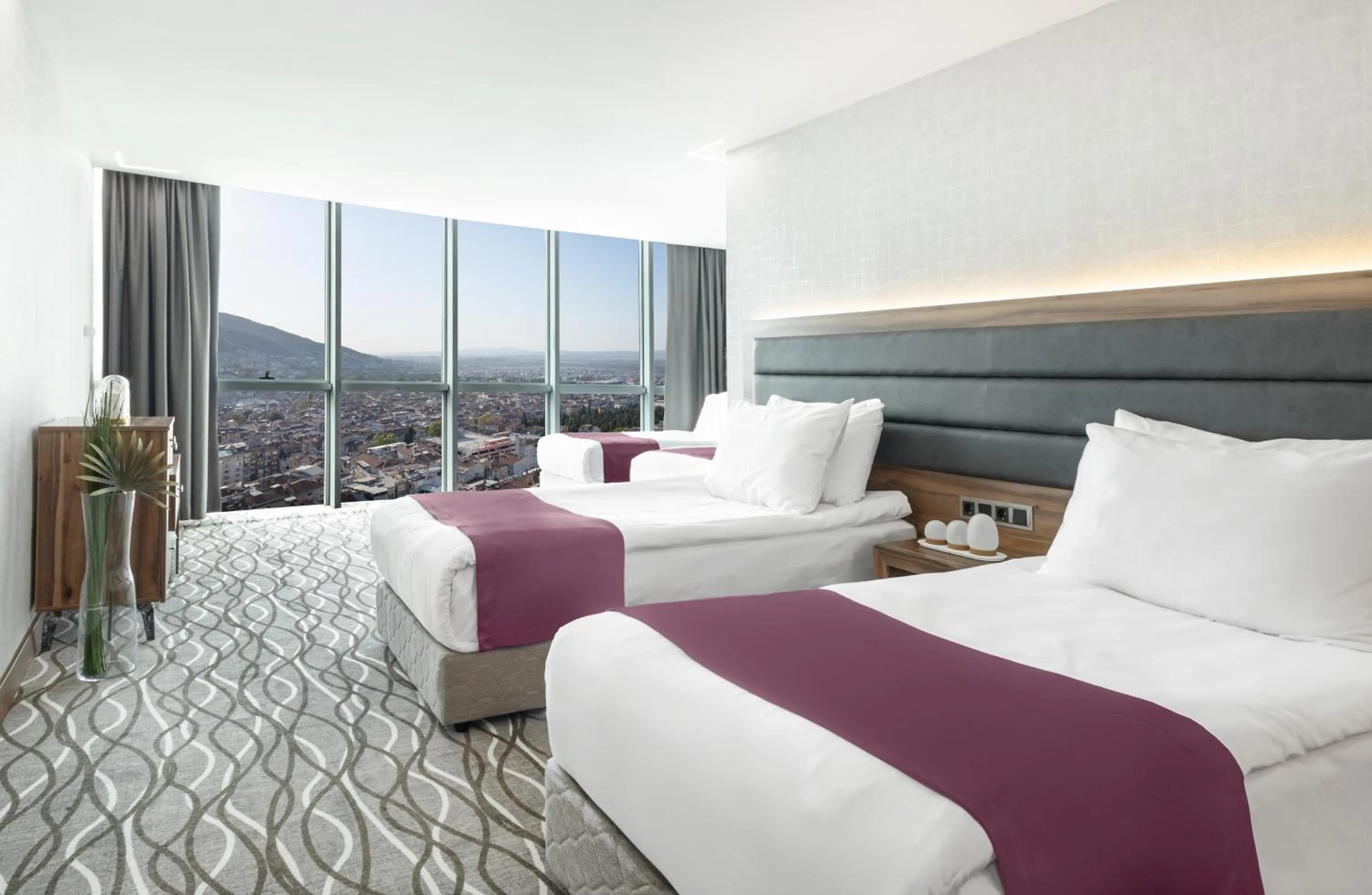 Bed in Lilium Hotel & Suites