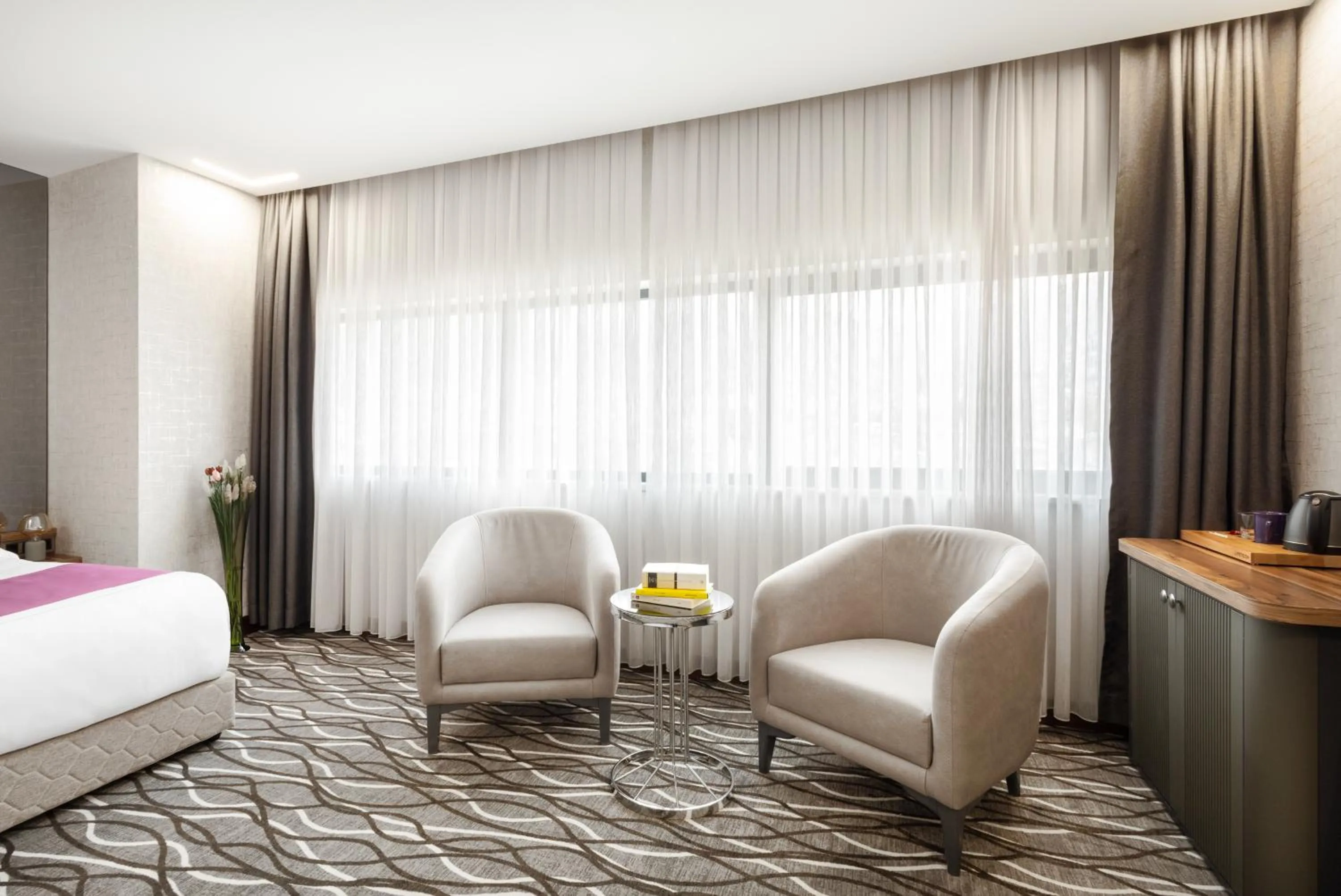 Seating area, Bed in Lilium Hotel & Suites