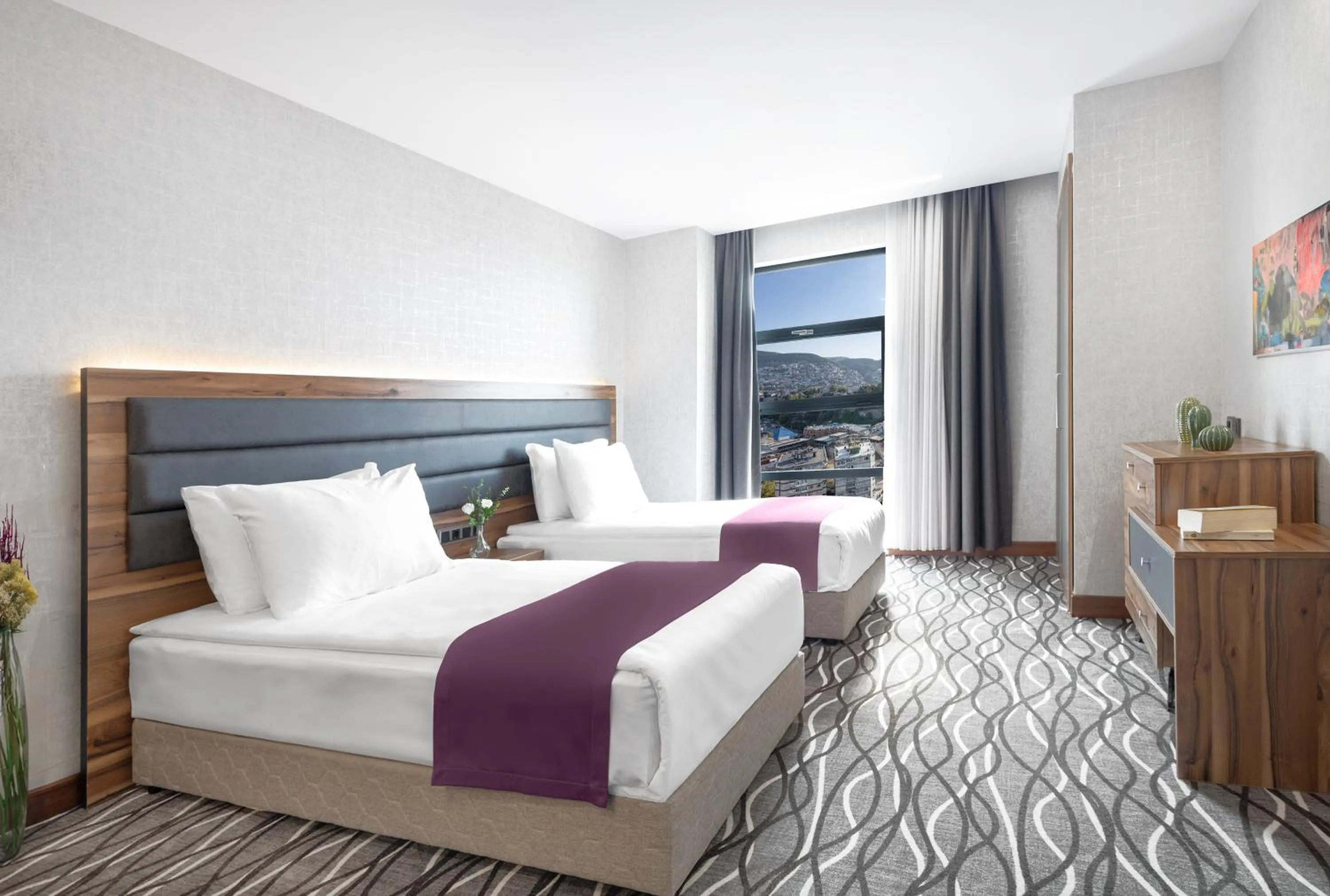 Bed in Lilium Hotel & Suites