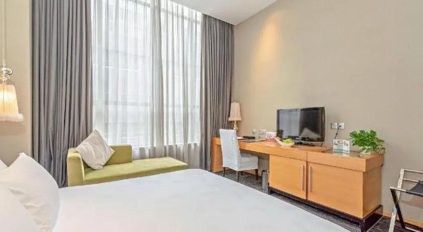 Bed in Guangzhou Carat Hotel