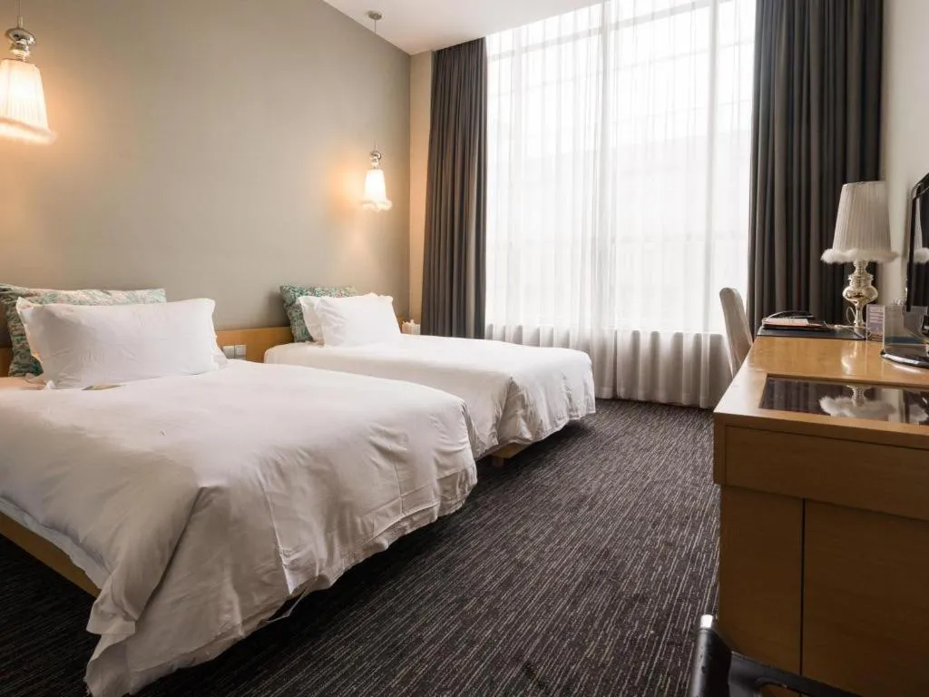 Bed in Guangzhou Carat Hotel