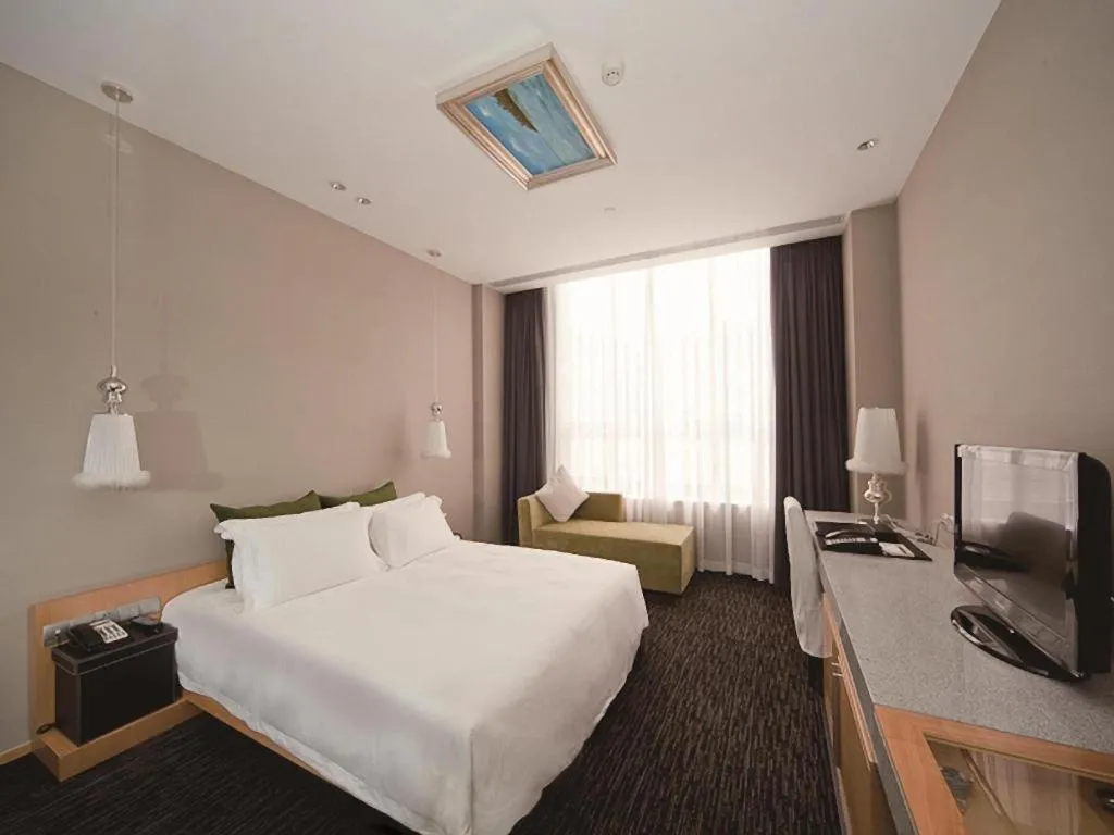 Bed in Guangzhou Carat Hotel