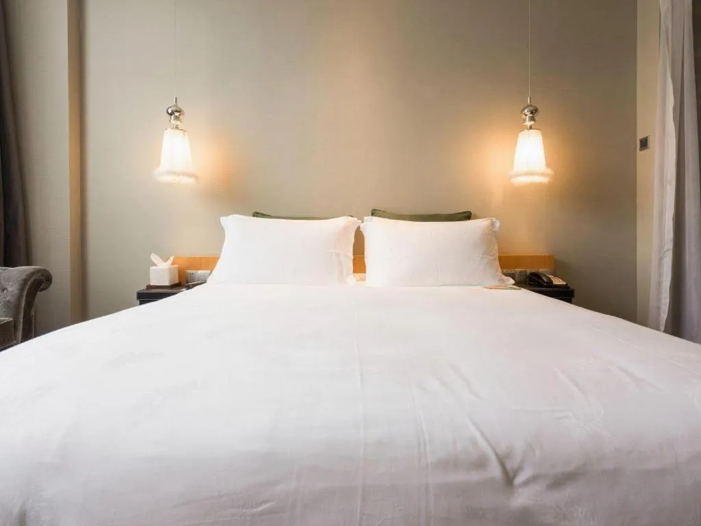 Bed in Guangzhou Carat Hotel