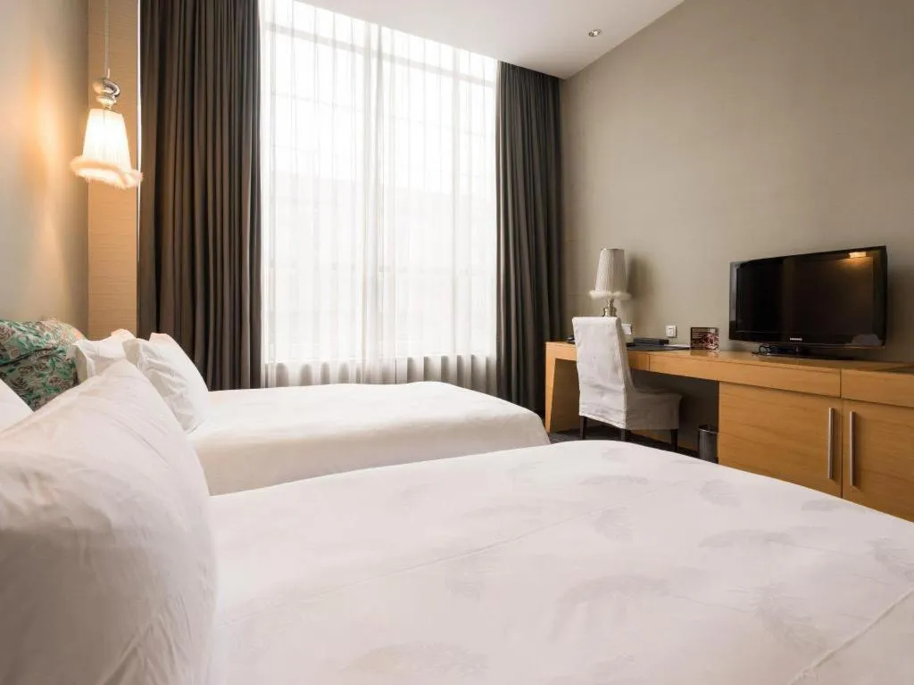 Bed in Guangzhou Carat Hotel