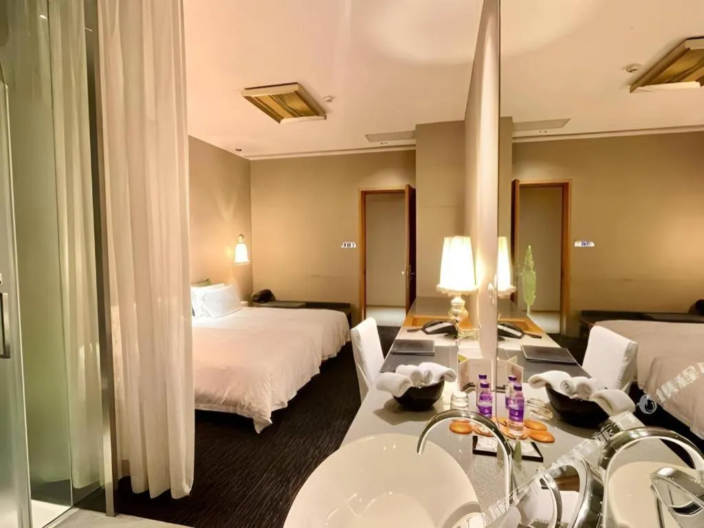 Bed in Guangzhou Carat Hotel