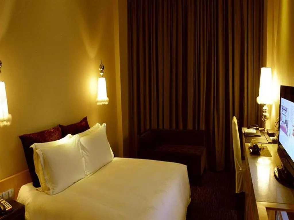 Bed in Guangzhou Carat Hotel