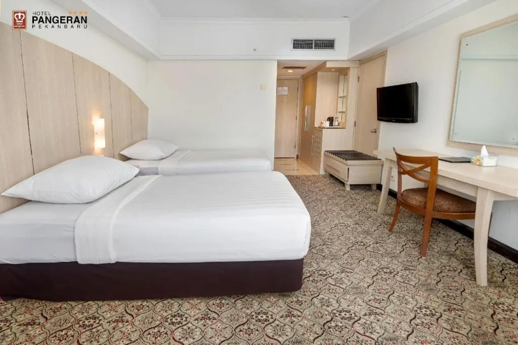 Bed in Hotel Pangeran