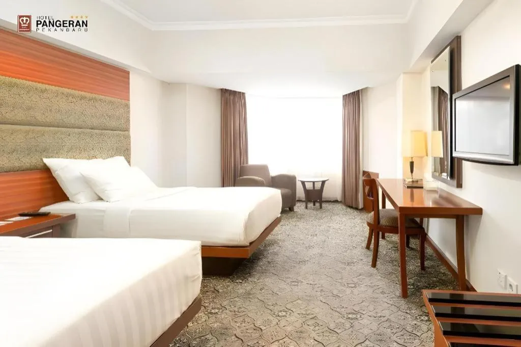 Bed in Hotel Pangeran