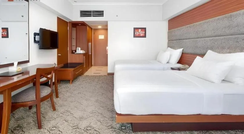 Bed in Hotel Pangeran