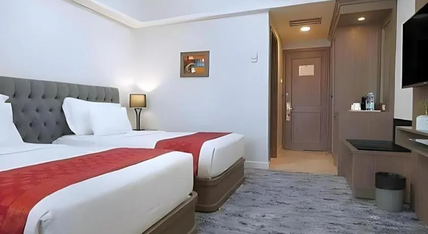 Bed in Hotel Pangeran