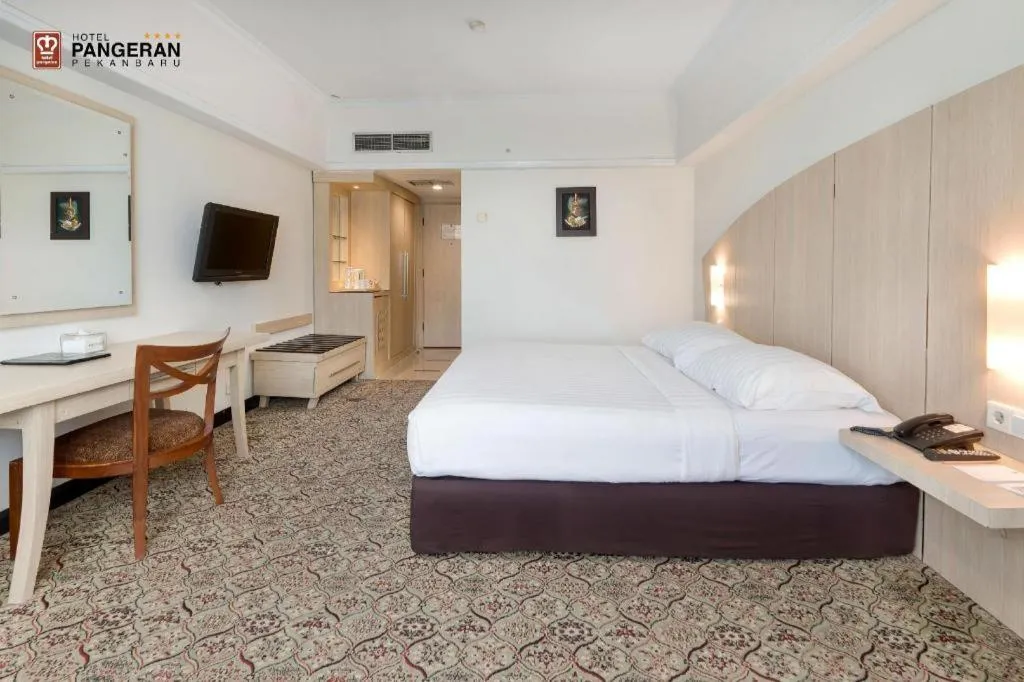 Bed in Hotel Pangeran