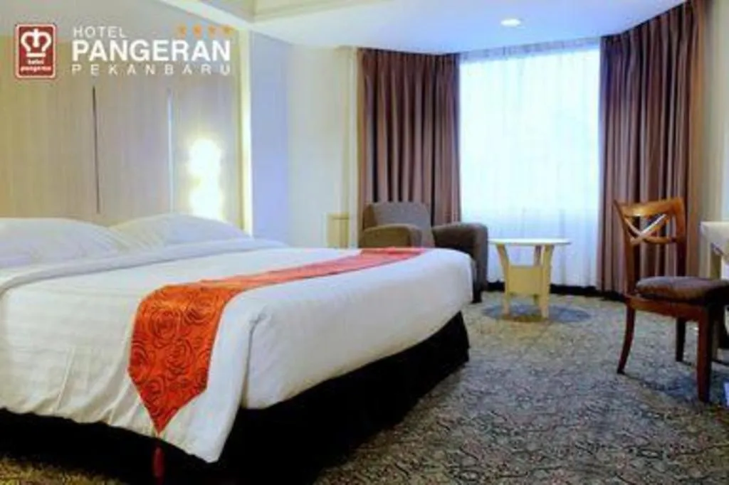 Bed in Hotel Pangeran