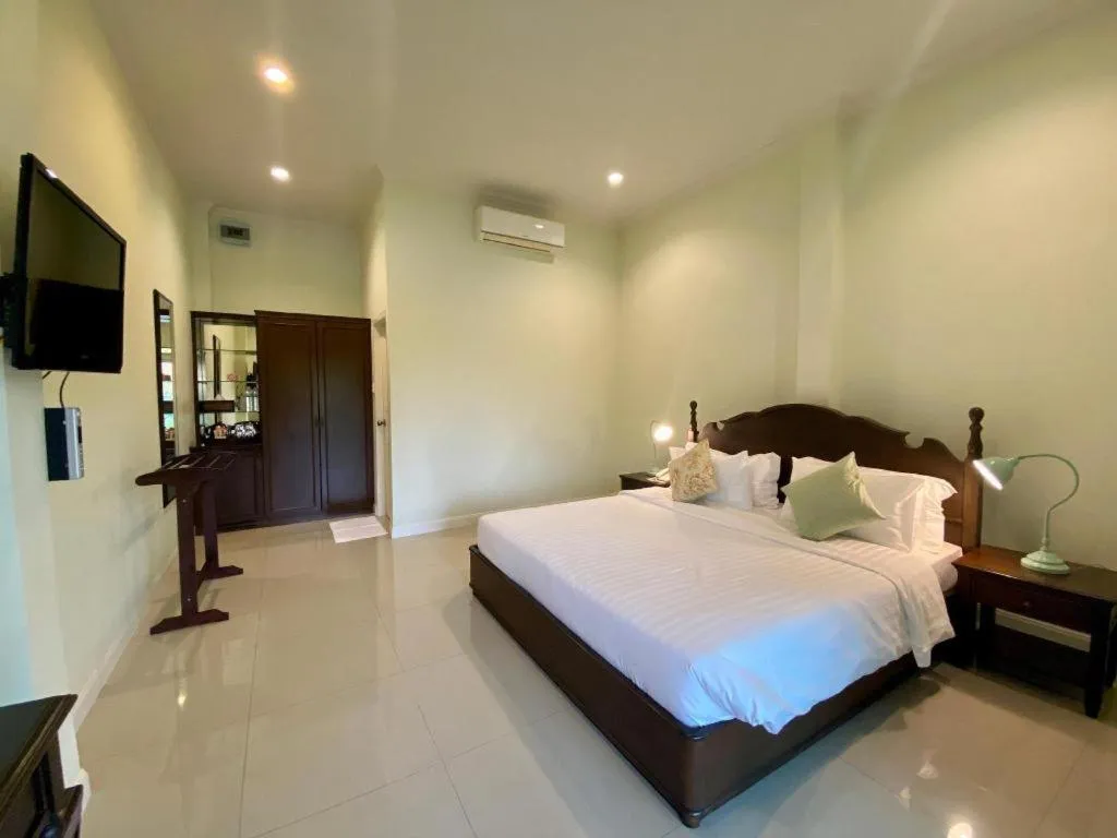 Bed in Ruen Maihom Riverside Cottage