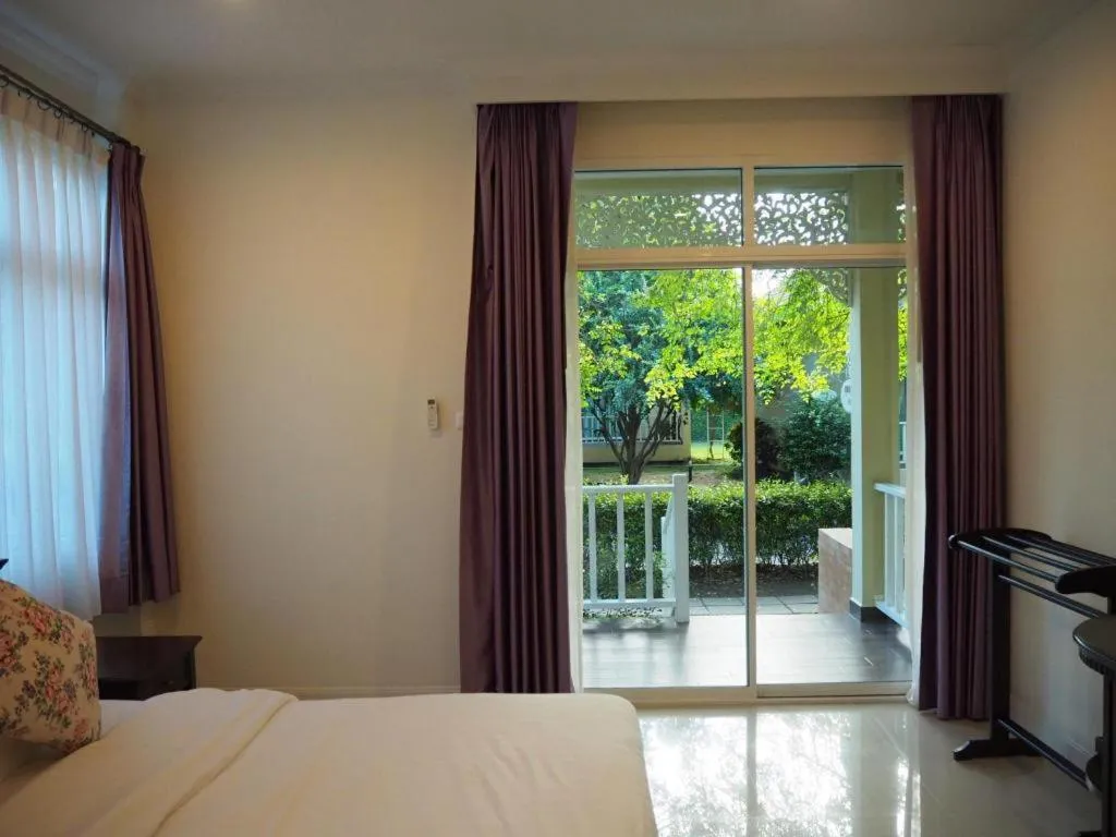 Bed in Ruen Maihom Riverside Cottage