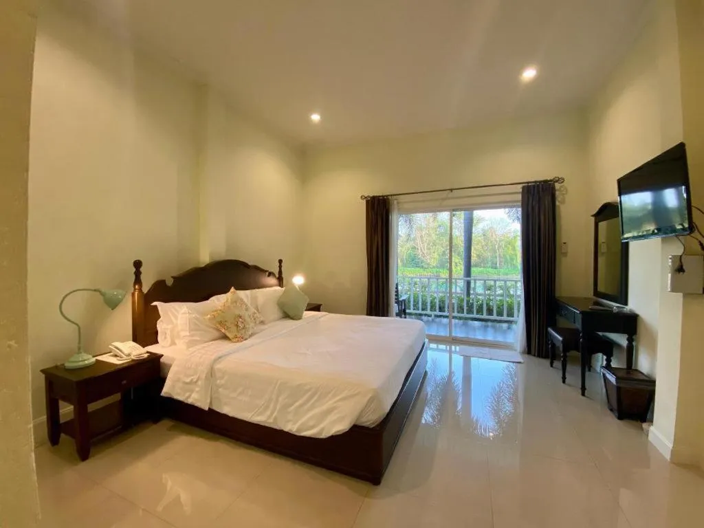 Bed in Ruen Maihom Riverside Cottage