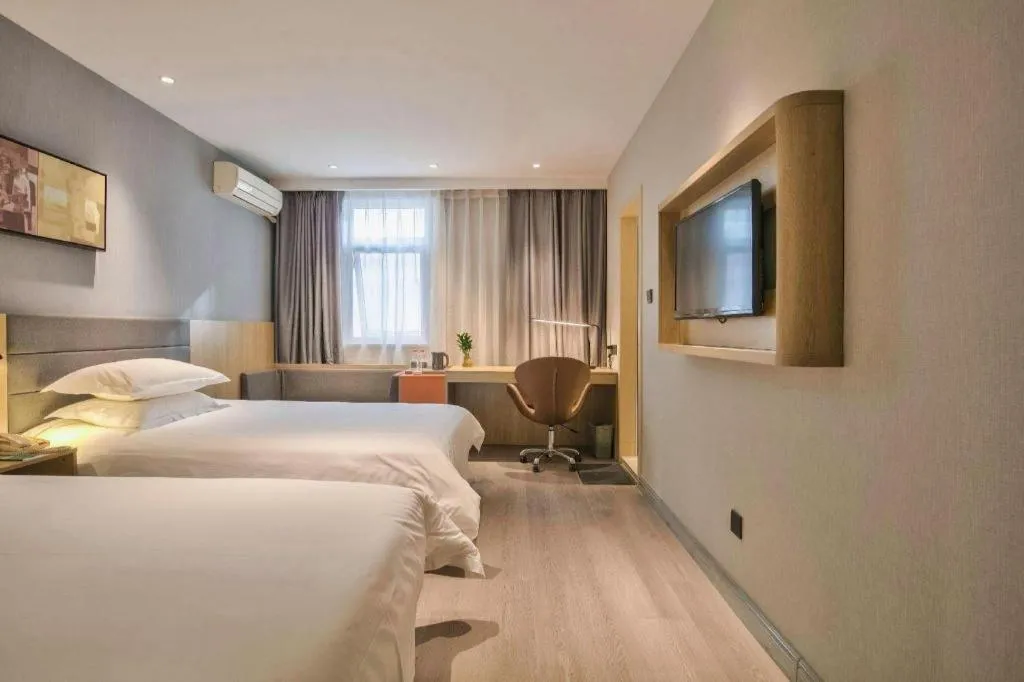 Bed in Jinjiang Inn Taizhou Huangyan Jiufeng Park