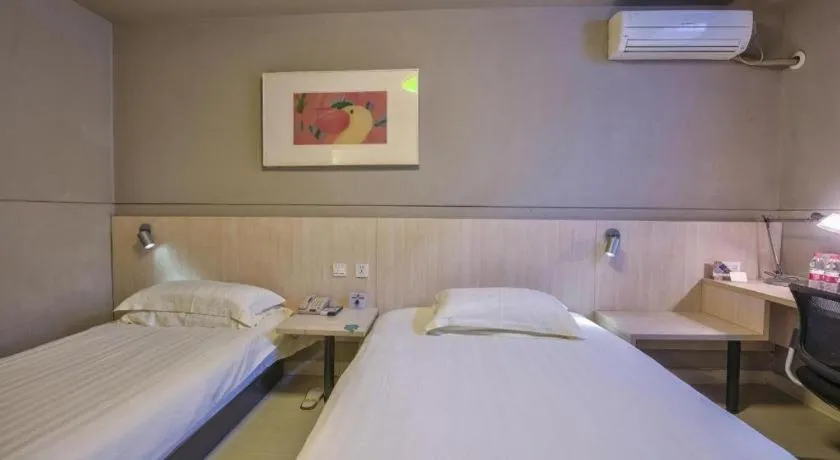 Bed in Jinjiang Inn Taizhou Huangyan Jiufeng Park