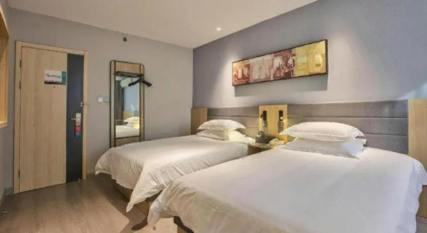 Bed in Jinjiang Inn Taizhou Huangyan Jiufeng Park