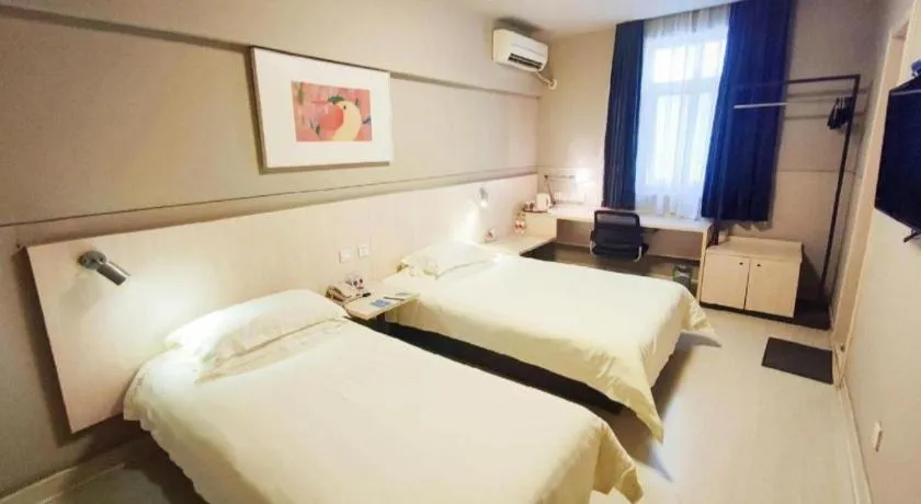 Bed in Jinjiang Inn Taizhou Huangyan Jiufeng Park