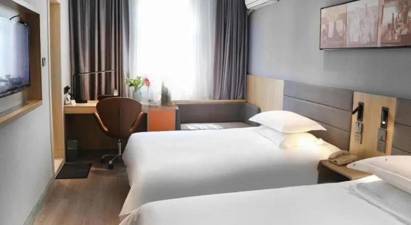 Bed in Jinjiang Inn Taizhou Huangyan Jiufeng Park