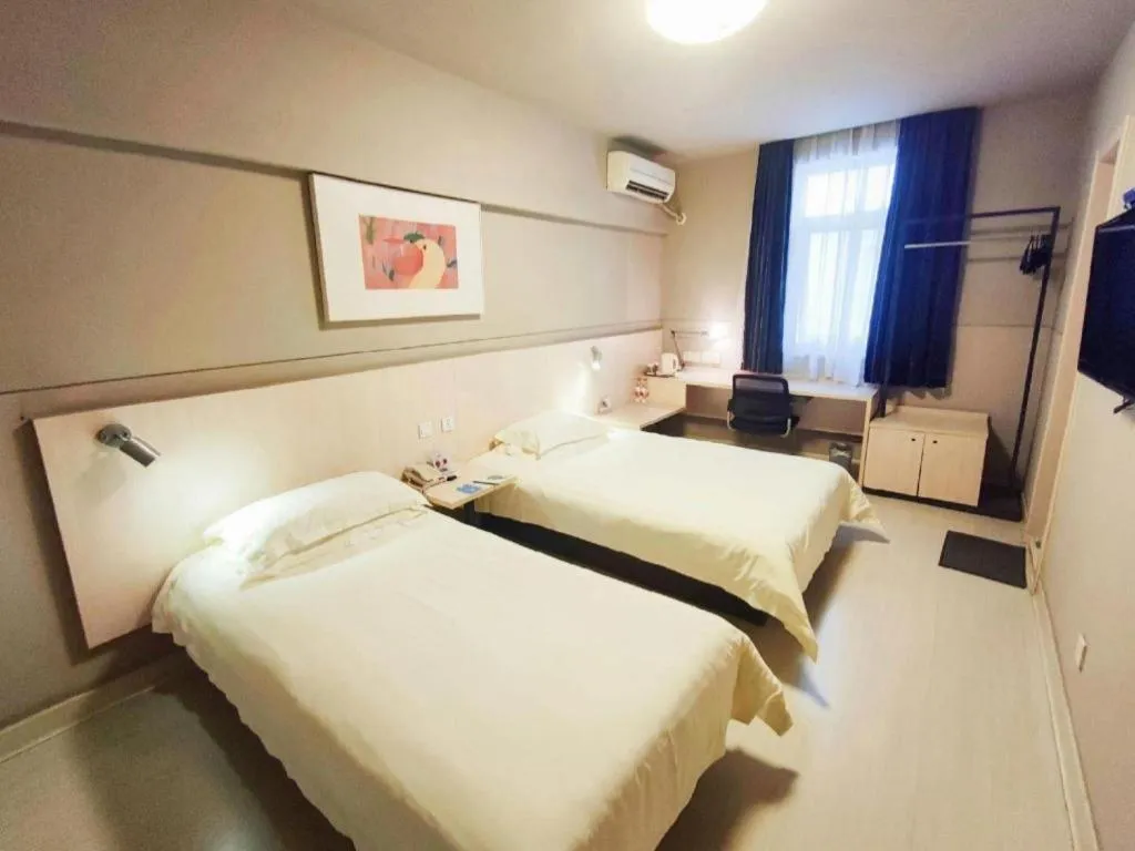 Bed in Jinjiang Inn Taizhou Huangyan Jiufeng Park