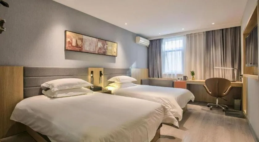 Bed in Jinjiang Inn Taizhou Huangyan Jiufeng Park