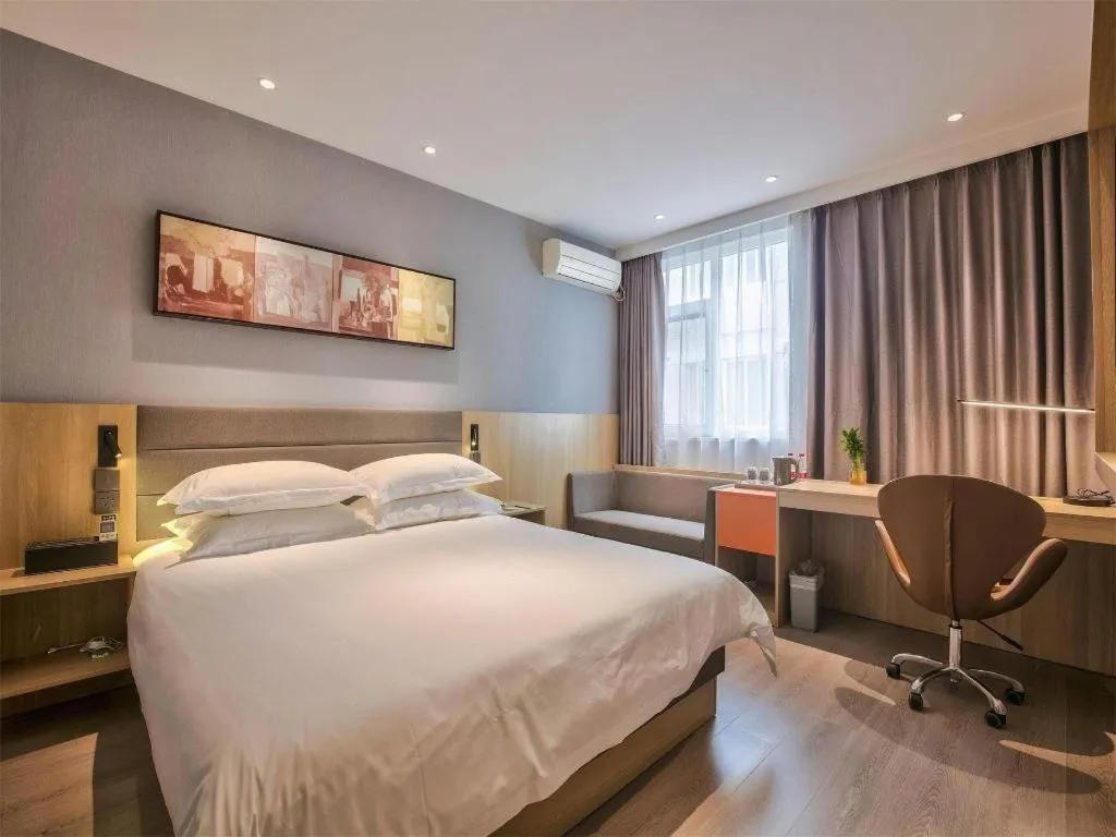 Bed in Jinjiang Inn Taizhou Huangyan Jiufeng Park