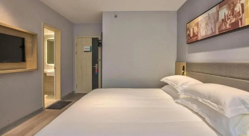Bed in Jinjiang Inn Taizhou Huangyan Jiufeng Park