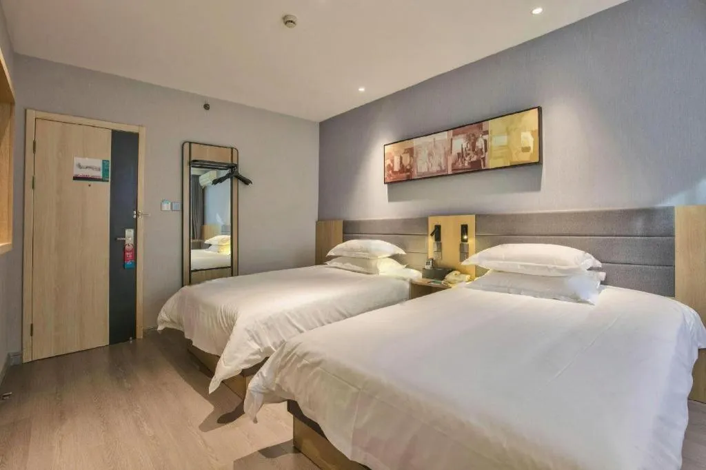 Bed in Jinjiang Inn Taizhou Huangyan Jiufeng Park