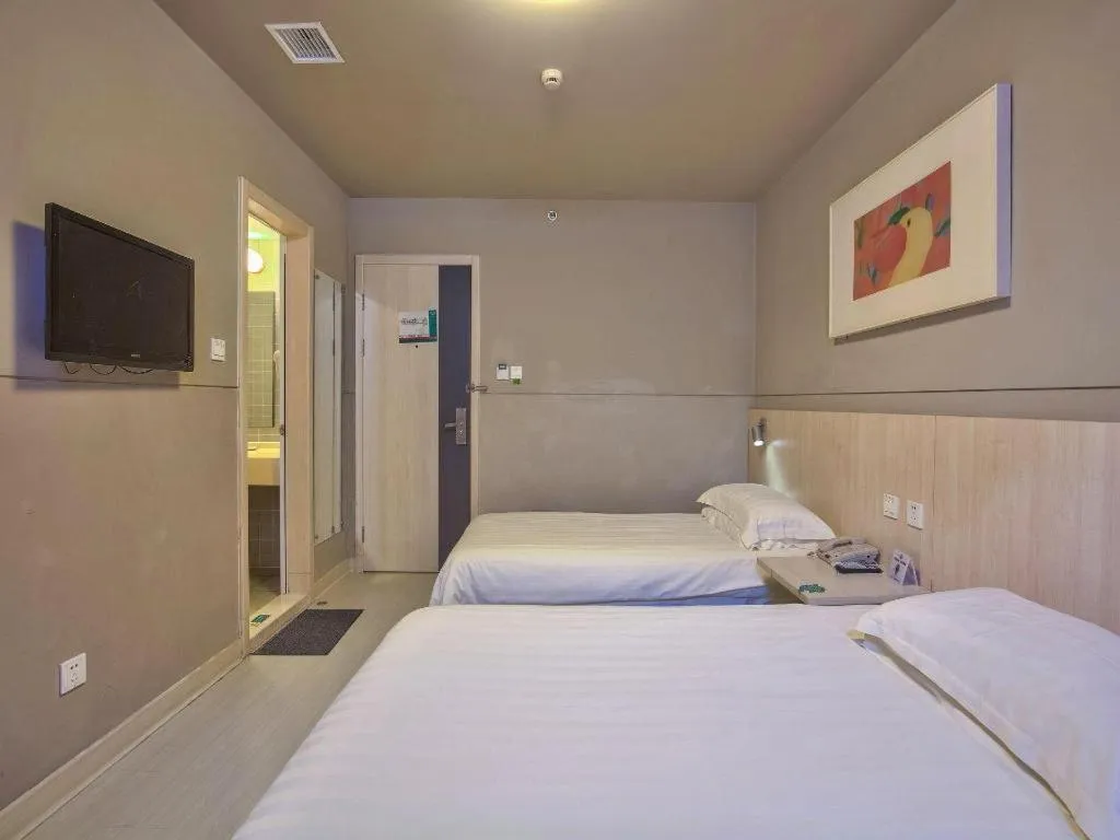 Bed in Jinjiang Inn Taizhou Huangyan Jiufeng Park