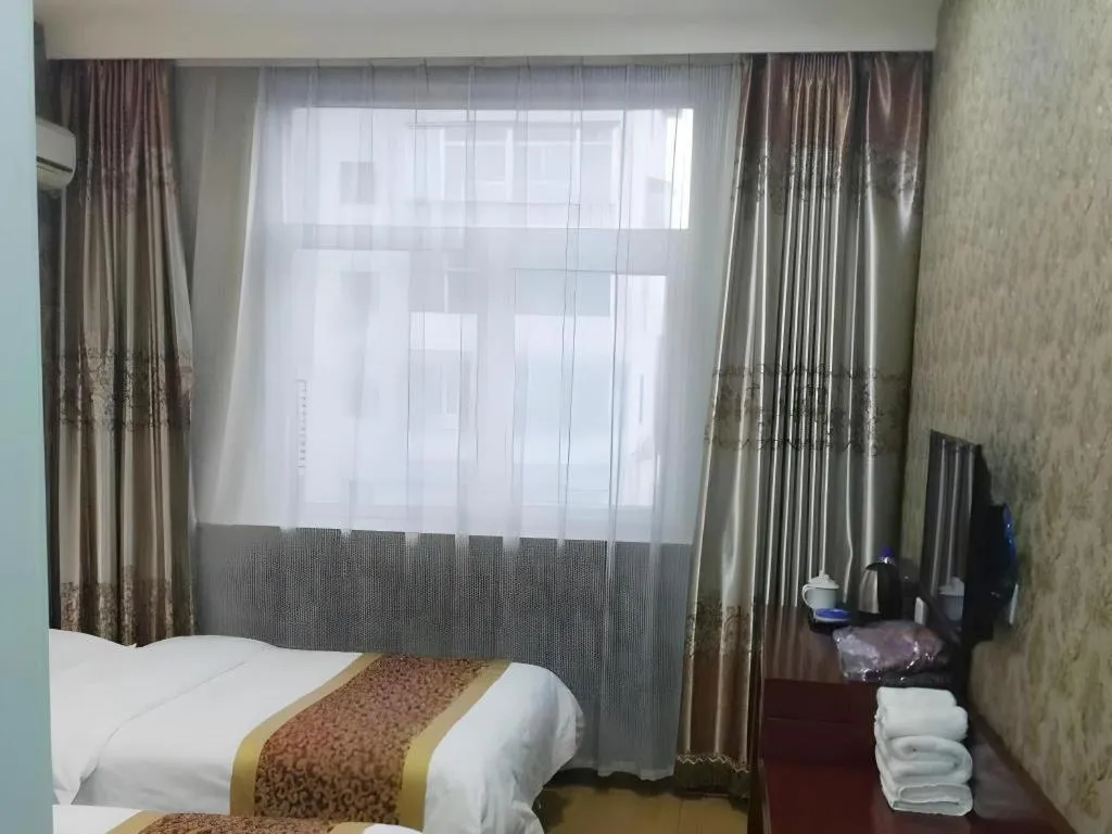 Bed in Shell Hotel Taiyuan South Railway Station New Southeast Bus Station
