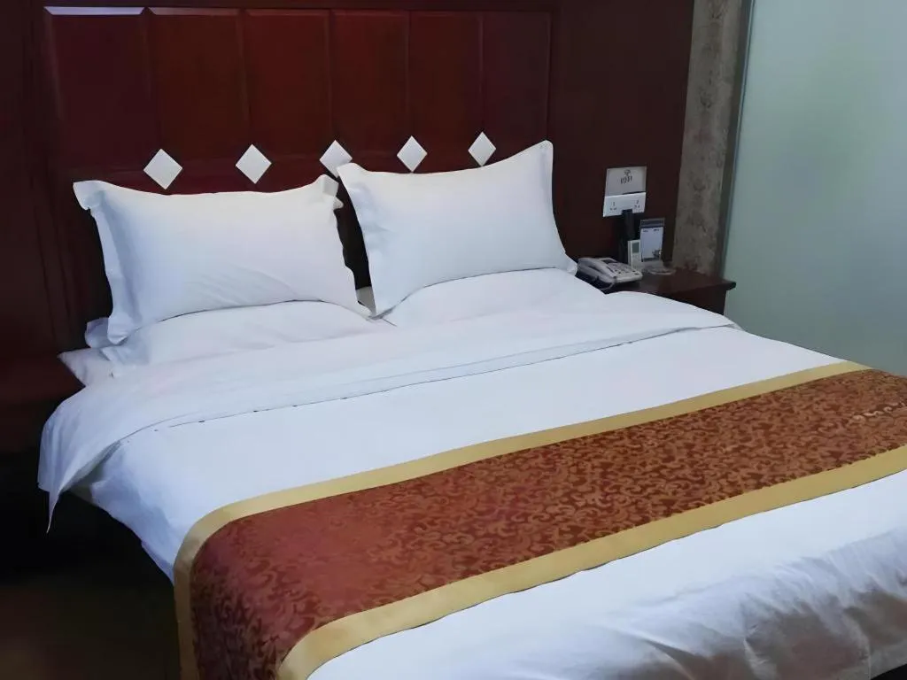 Bed in Shell Hotel Taiyuan South Railway Station New Southeast Bus Station