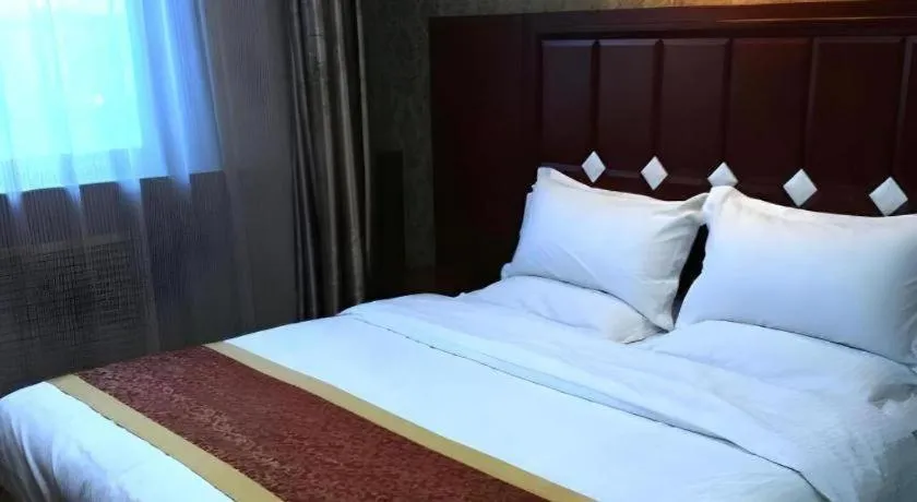 Bed in Shell Hotel Taiyuan South Railway Station New Southeast Bus Station