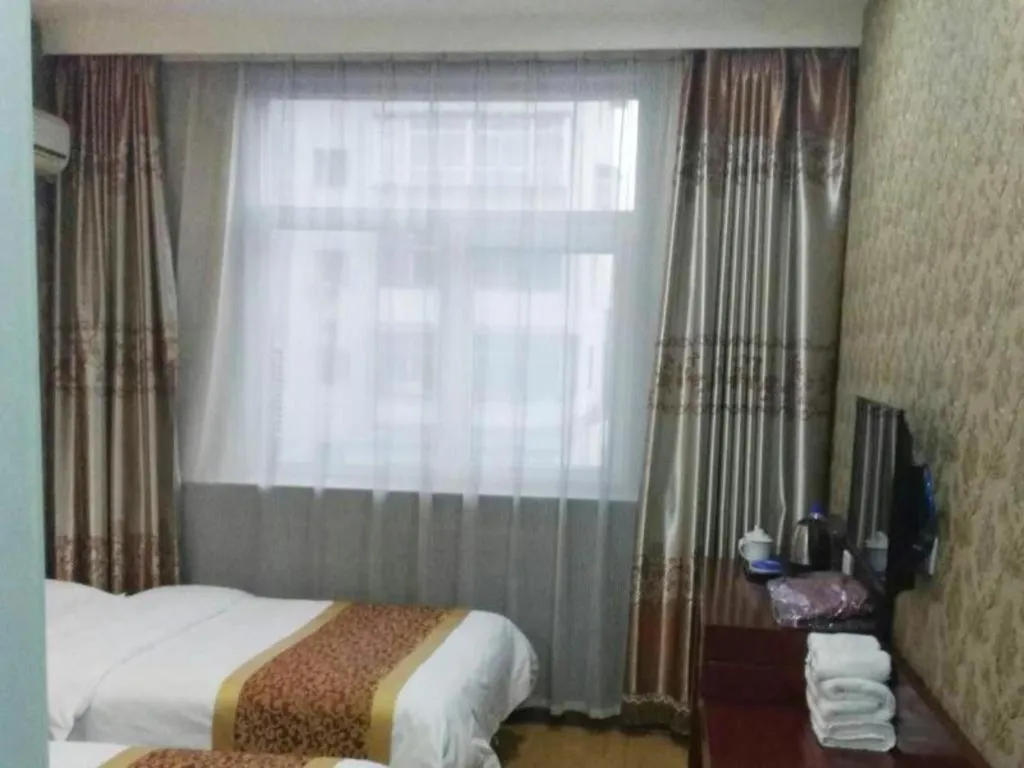 Bed in Shell Hotel Taiyuan South Railway Station New Southeast Bus Station
