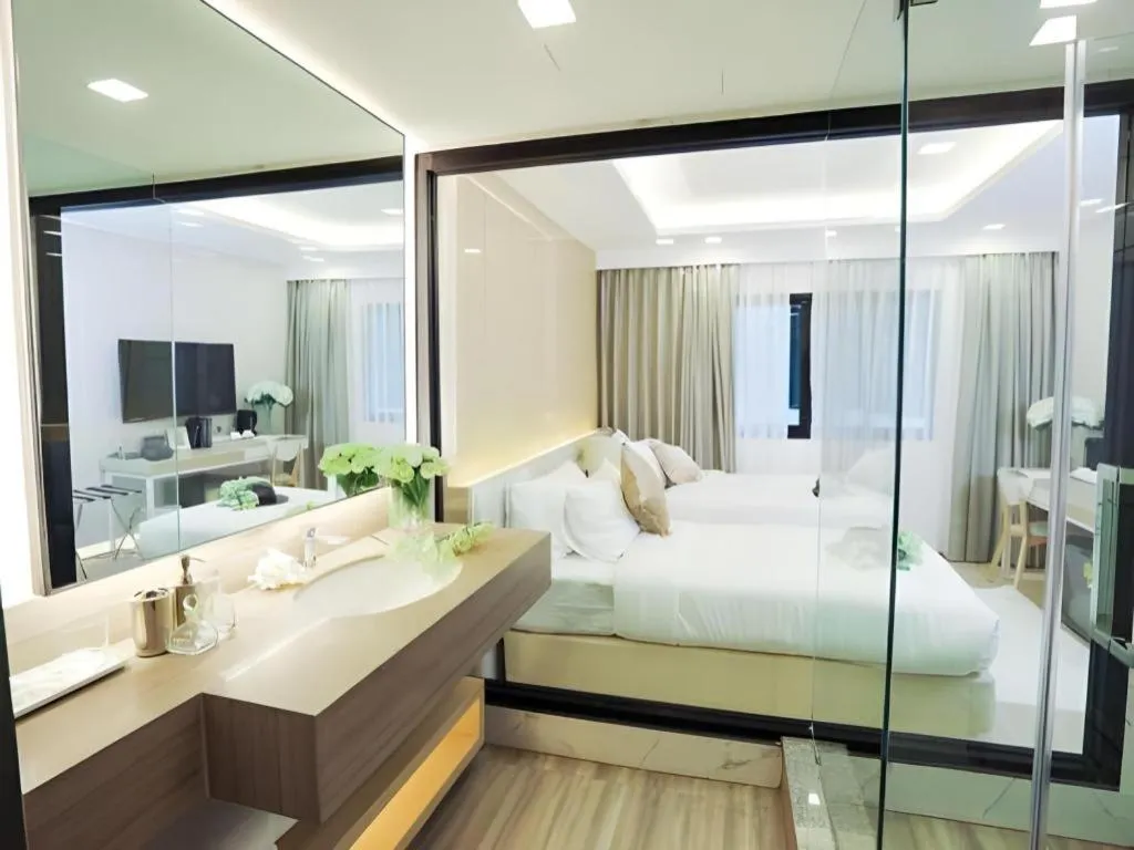 Bed in Thaisun Bangkok Hotel