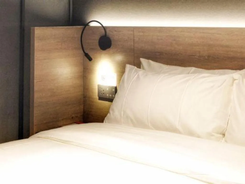 Bed in Opus Hotel Jiangmen