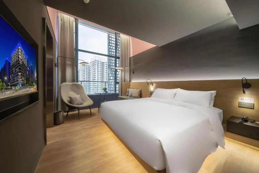 Bed in Opus Hotel Jiangmen