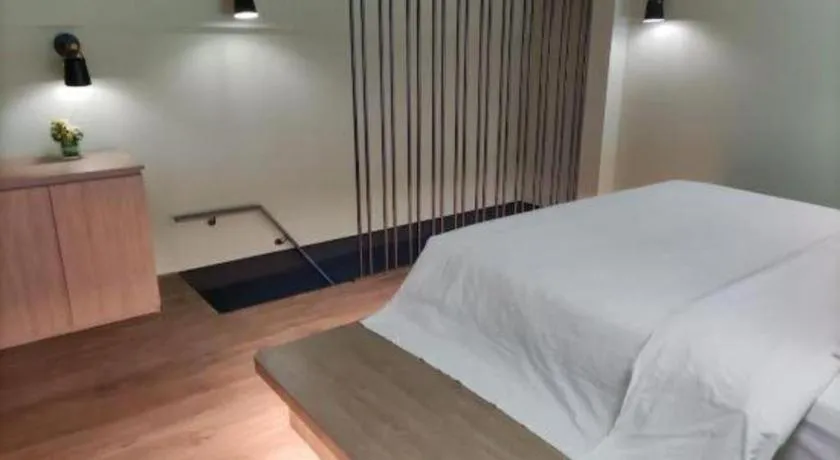 Bed in Opus Hotel Jiangmen