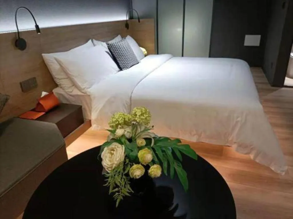 Bed in Opus Hotel Jiangmen