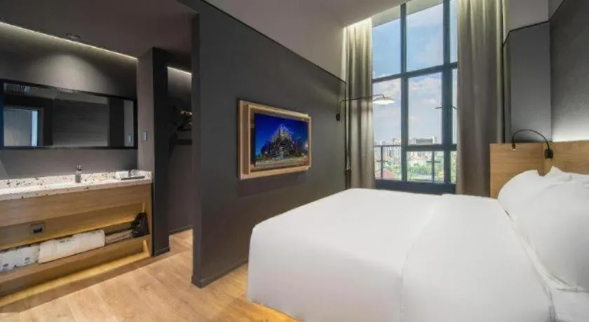 Bed in Opus Hotel Jiangmen
