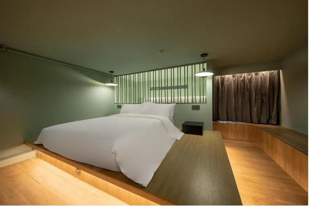 Bed in Opus Hotel Jiangmen