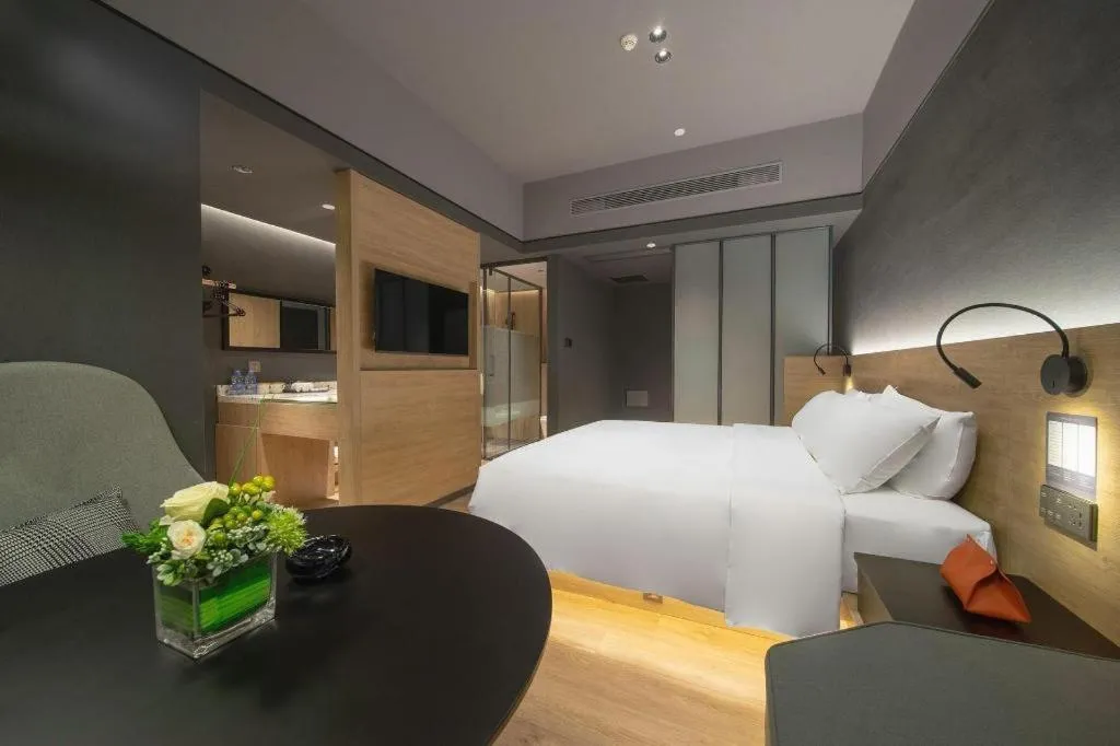 Bed in Opus Hotel Jiangmen