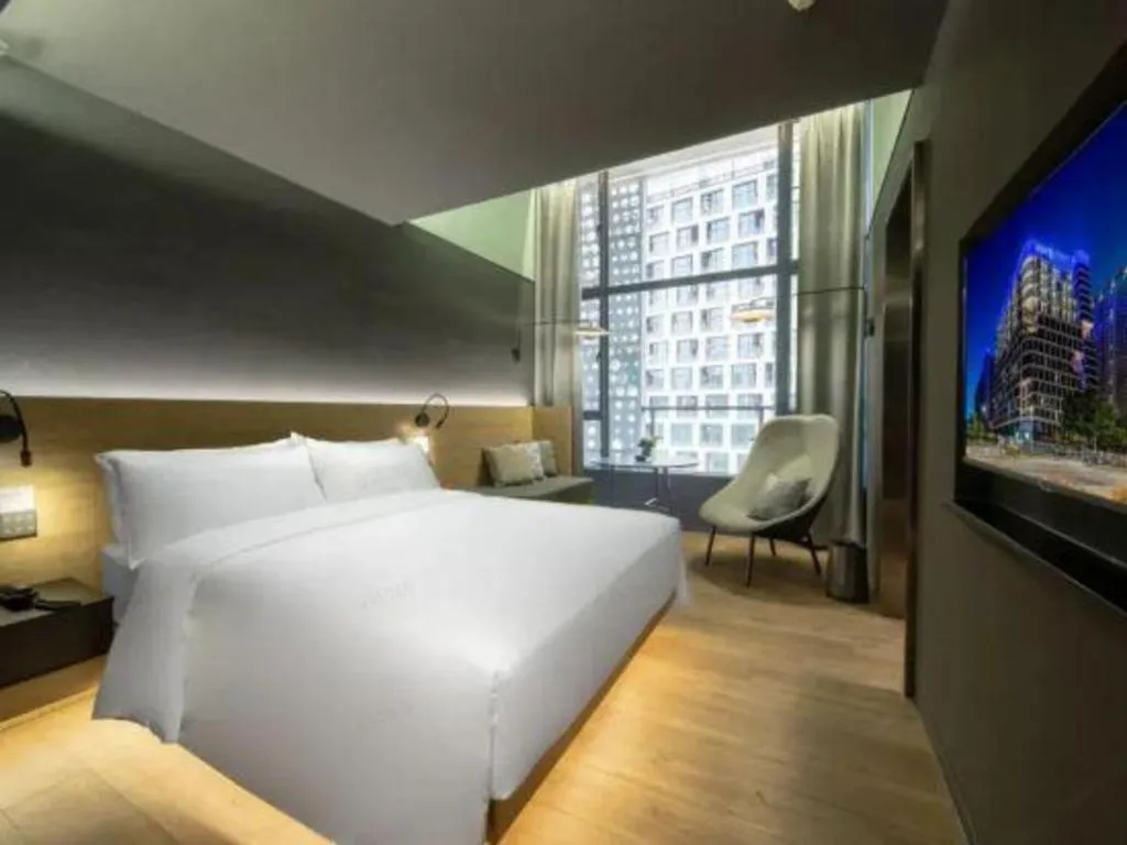 Bed in Opus Hotel Jiangmen