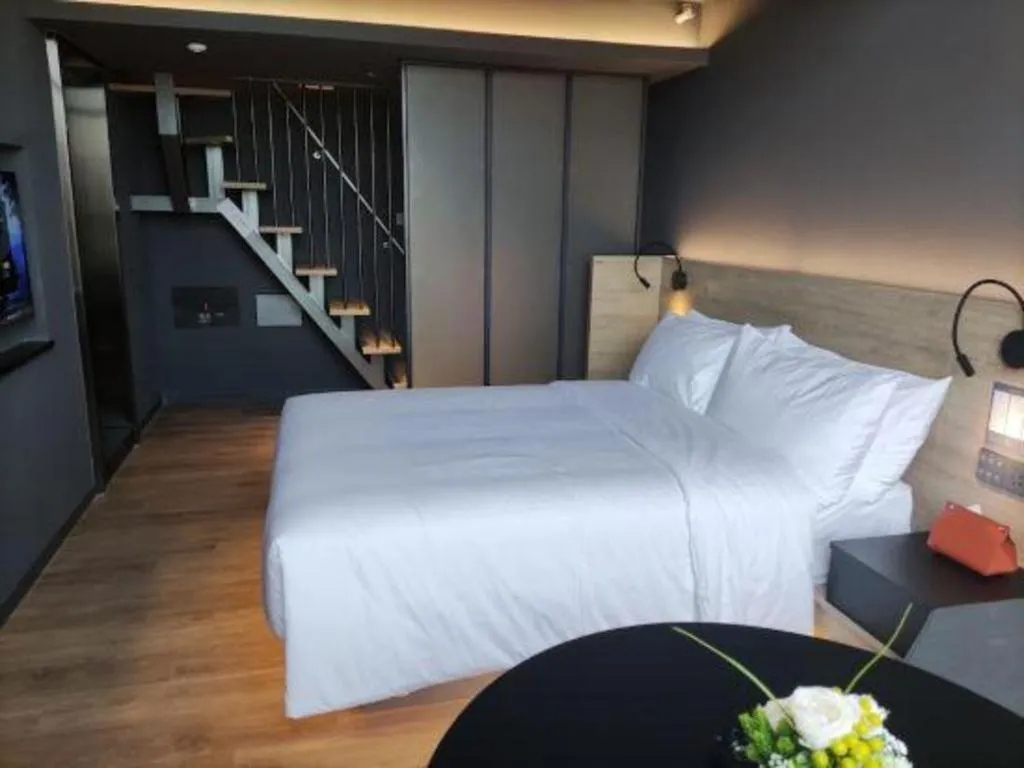 Bed in Opus Hotel Jiangmen